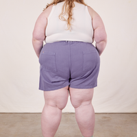 Back view of Classic Work Shorts in Faded Grape and vintage off-white Tank Top worn by Catie