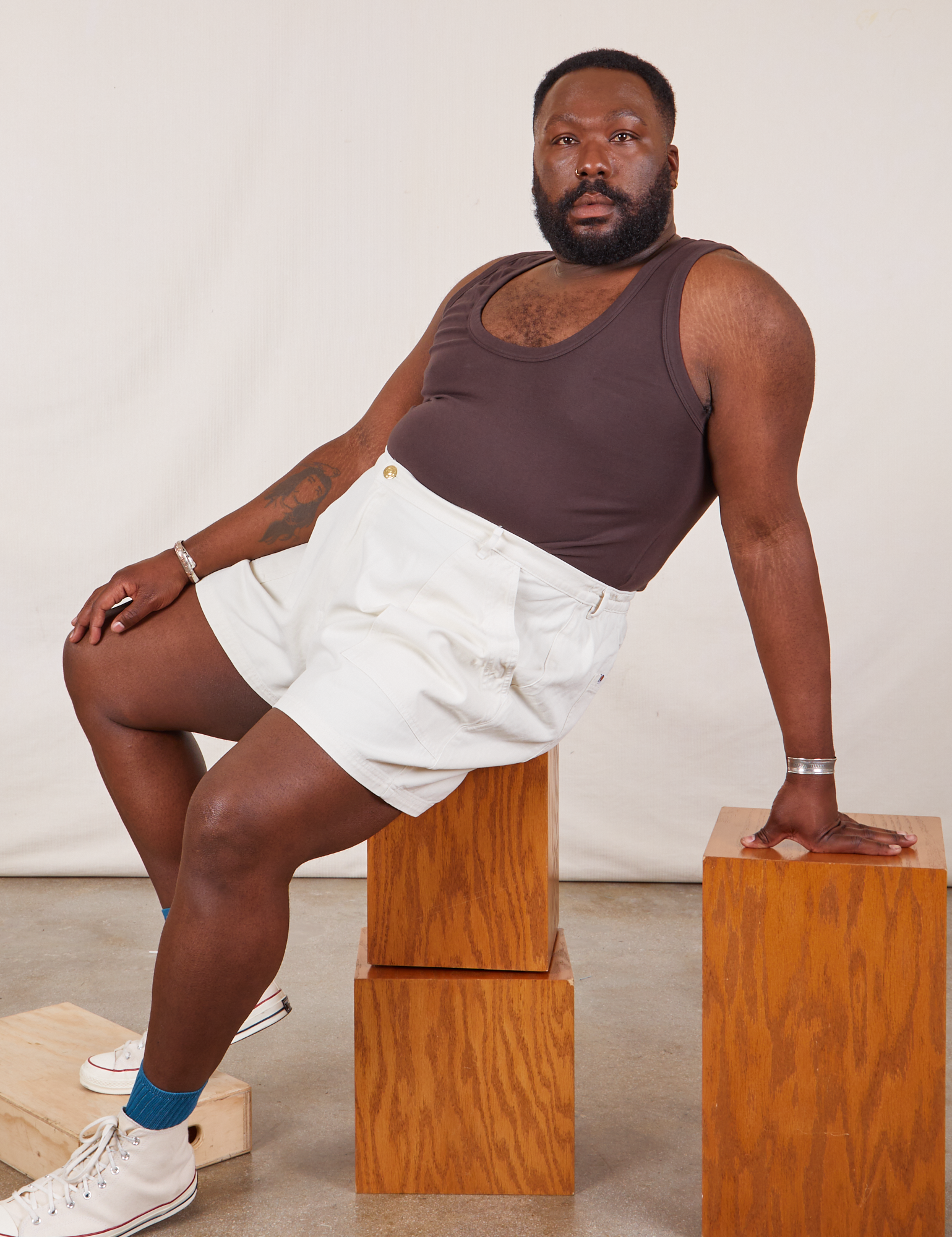 Elijah is wearing Classic Work Shorts in Vintage Tee Off-White and espresso brown Tank Top