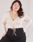 Ashley is 5'7" and wearing size 4 Wrap Top in Vintage Tee Off-White