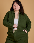 Ashley is 5’7” and wearing L Heritage Mechanic Jacket in Evergreen