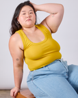 Ashley is wearing Cropped Tank Top in Golden Yellow