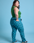 Angled back view of Checkerboard Work Pants in Blues and lawn green Cropped Tank on Ashley