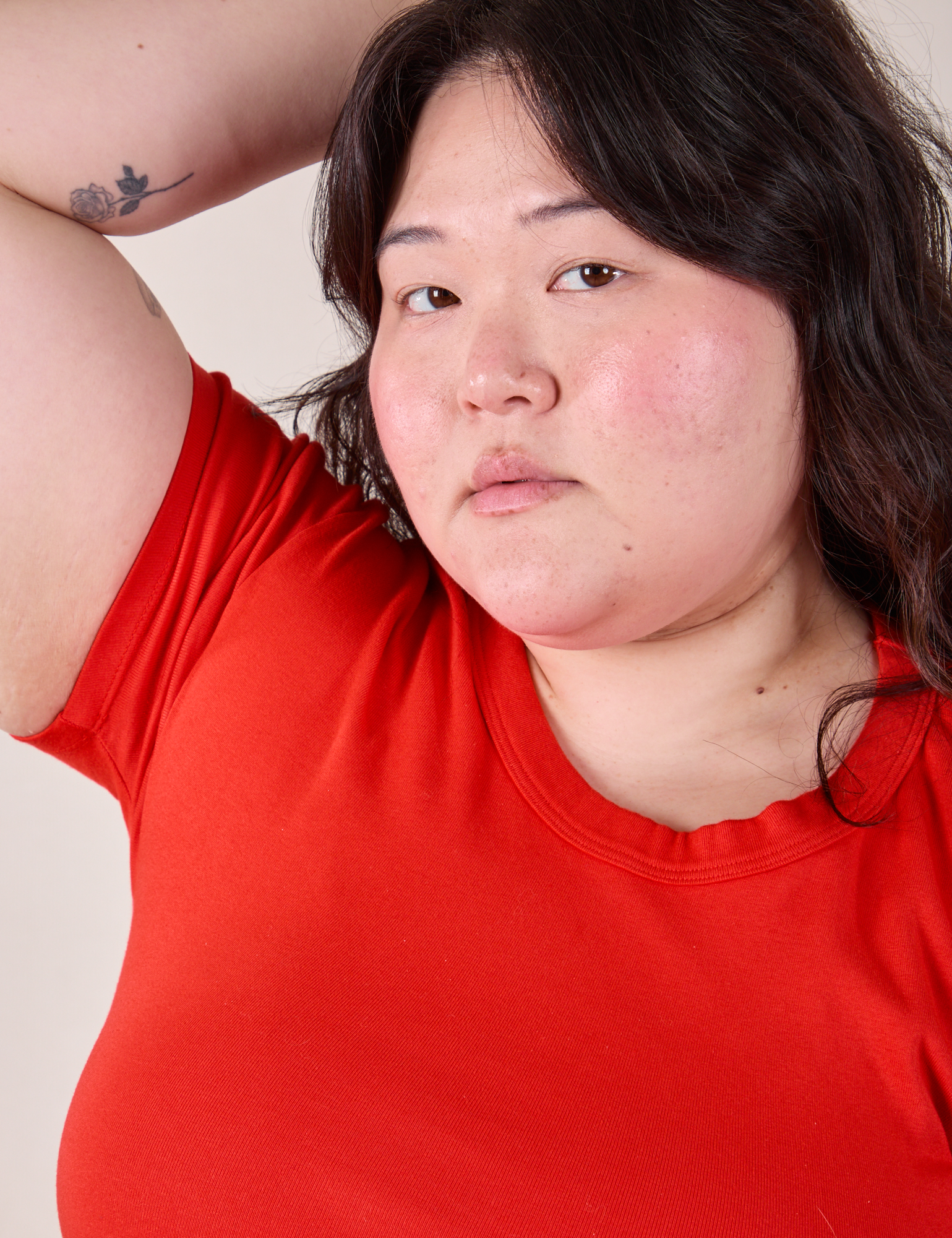 Baby Tee in Mustang Red front close up on Ashley