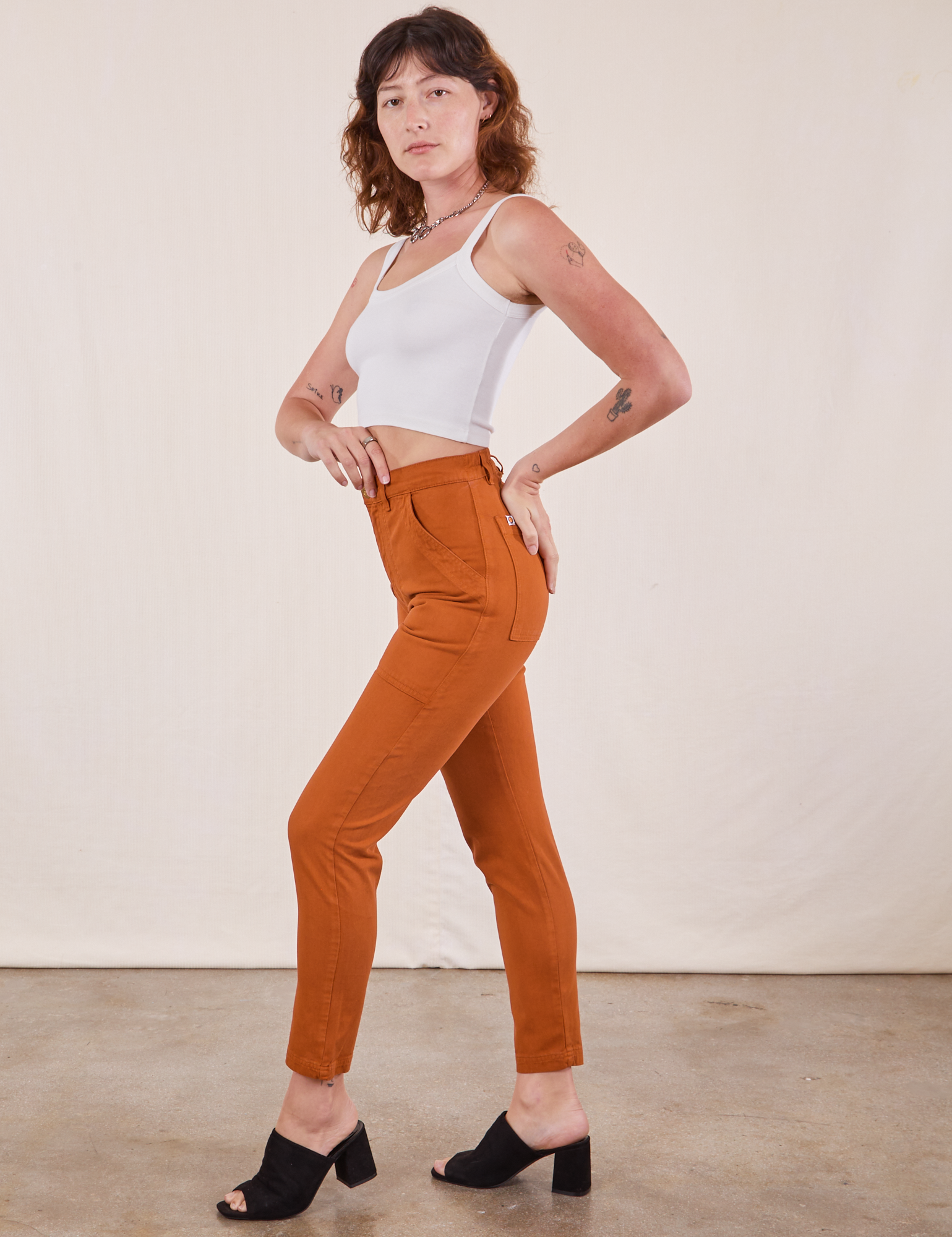 Side view of Pencil Pants in Burnt Terracotta and Cropped Cami in vintage tee off-white 