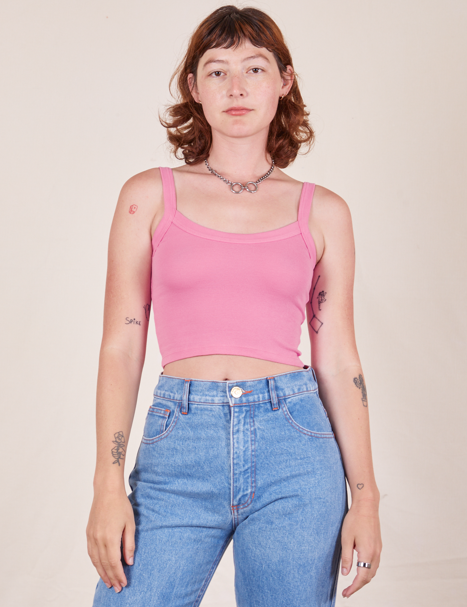Alex is 5&#39;8&quot; and wearing P Cropped Cami in Bubblegum Pink paired with light wash Frontier Jeans