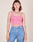 Alex is 5'8" and wearing P Cropped Cami in Bubblegum Pink paired with light wash Frontier Jeans