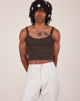 Jerrod is 6'3" and wearing S Cropped Cami in Espresso Brown paired with vintage tee off-white Western Pants