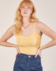 Margaret is 5’11” and wearing P Cropped Cami in Butter Yellow