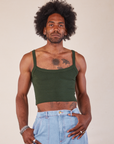 Jerrod is wearing Cropped Cami in Swamp Green
