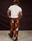 Back view of Gummy Bear Paintstamped Work Pants in Fudgesicle Brown and Organic Vintage Tee in Vintage Off-White