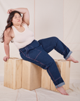 Ashley is wearing Carpenter Jeans in Dark Wash and Tank Top in vintage tee off-white