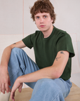 Quinn is wearing Cropped Burly Tee in Swamp Green
