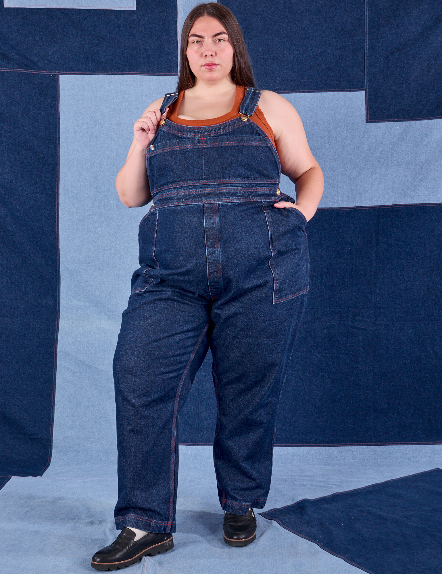 Marielena is 5'8" and wearing 2XL Indigo Denim Original Overalls in Dark Wash