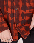 Front close up of Plaid Flannel Overshirt in Paprika on Alex