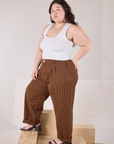 Angled front view of Checker Trousers in Brown & Black and Tank Top in vintage tee off-white on Ashley