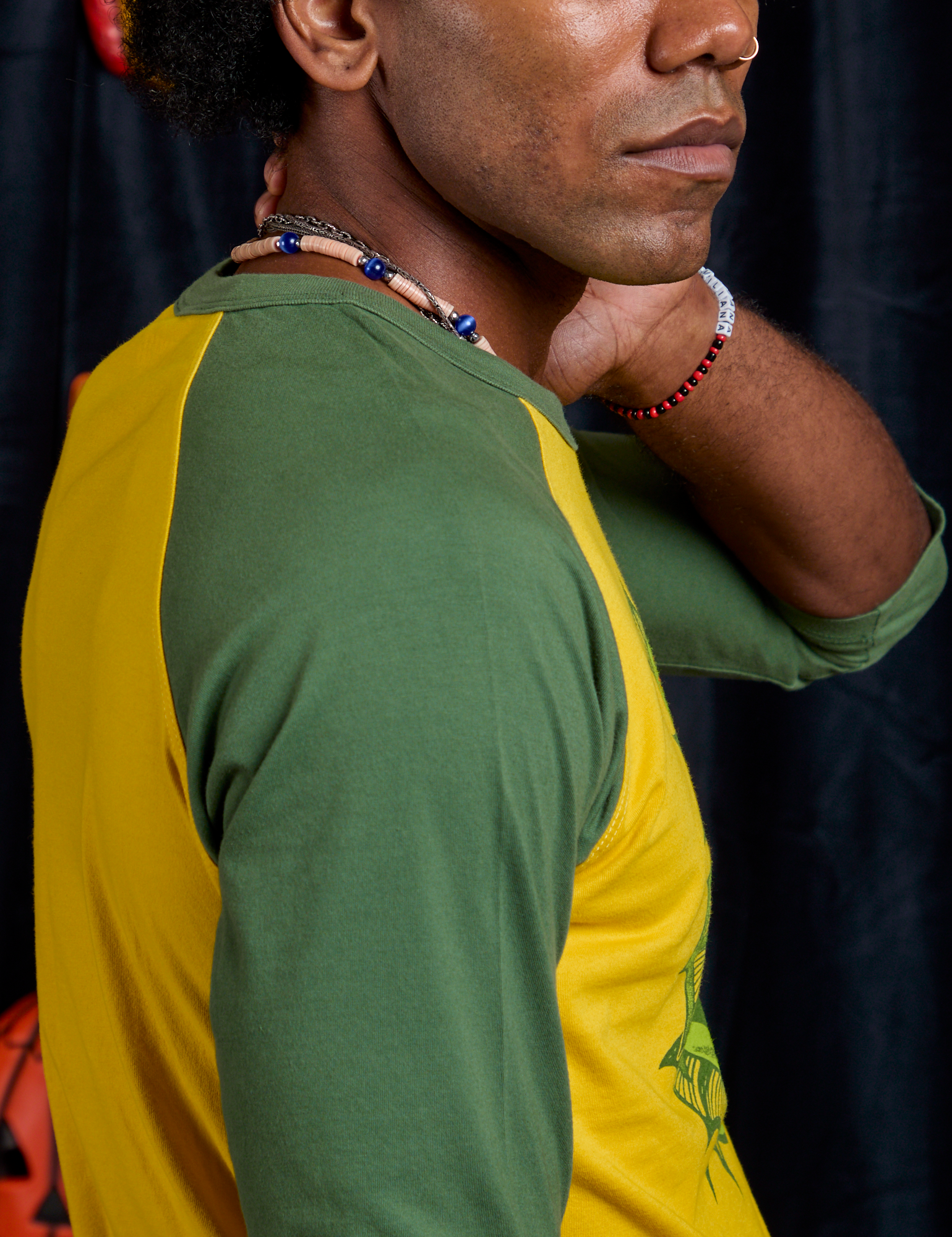 Side shoulder close up of Raglan Tee in Creature on Jerrod