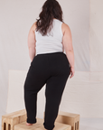 Back view of Rolled Cuff Sweat Pants in Basic Black and Cropped Tank in vintage tee off-white on Ashley