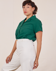 Angled view of Pantry Button-Up in Hunter Green worn by Tiara