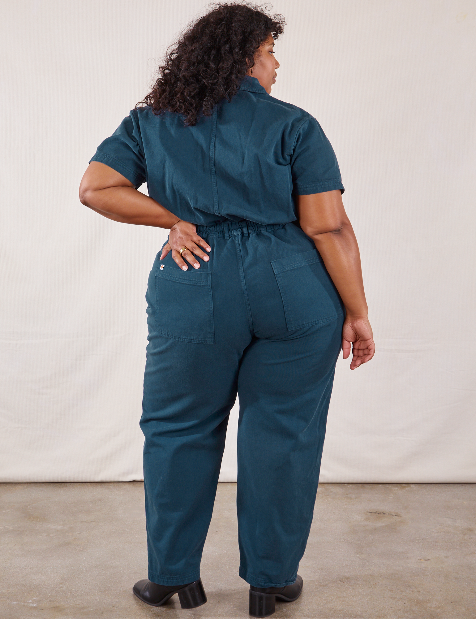 Short Sleeve Jumpsuit in Lagoon back view on Morgan