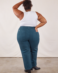 Back view of Work Pants in Lagoon and vintage tee off-white Tank Top on Morgan