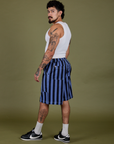 Side view of Longline Work Shorts in Cornflower and Cropped Tank in Vintage Tee White on Jesse