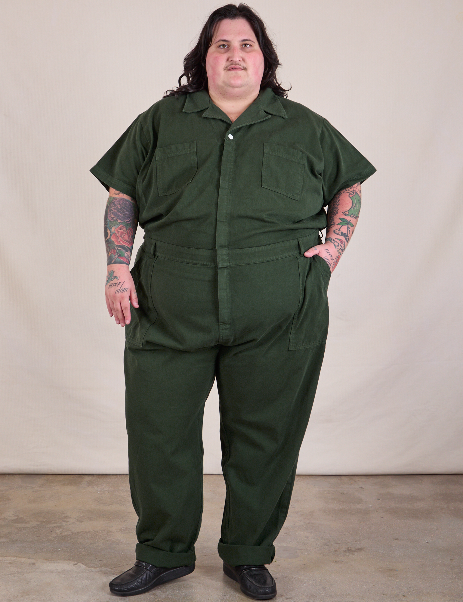 Sam is 5'10" and wearing 4XL Long Jumpsuit in Swamp Green