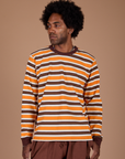Jerrod is 6’3” and wearing M Long Sleeve Striped Burly Tee in Orange