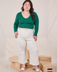 Ashley is wearing Long Sleeve V-Neck Tee in Hunter Green and vintage tee off-white Petite Western Pants