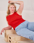 Lish is wearing Muscle Tee in Mustang Red and light wash Carpenter Jeans