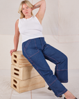 Lish is wearing Muscle Tee in Vintage Tee Off-White and dark wash Carpenter Jeans