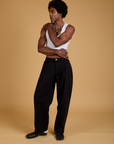 Jerrod is wearing Baggy Mid-Rise Trousers in Basic Black