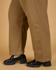 Pant leg side view close up of Baggy Mid-Rise Trousers in Desert Brown on Juliet
