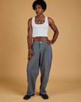 Jerrod is 6'3" and wearing M Baggy Mid-Rise Trousers in Slate Grey paired with a vintage tee white Cropped Tank