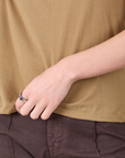 Mismatched Tee in Tan & Brown bottom hem close up on Alex