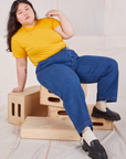 Ashley is wearing Organic Vintage Tee in Sunshine Yellow and dark wash Trouser Jeans
