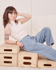 Hana is wearing Organic Trousers in Periwinkle and Sleeveless Turtleneck in vintage tee off-white