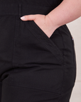 Front pocket close up of Petite Short Sleeve Jumpsuit in Basic Black worn by Ashley