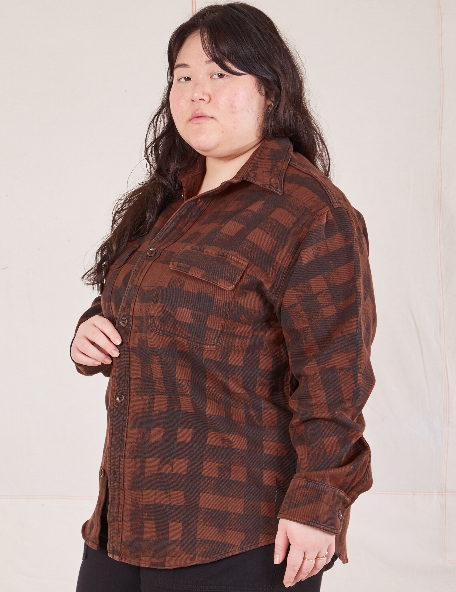 Angled view of Plaid Flannel Overshirt in Fudgesicle Brown on Ashley