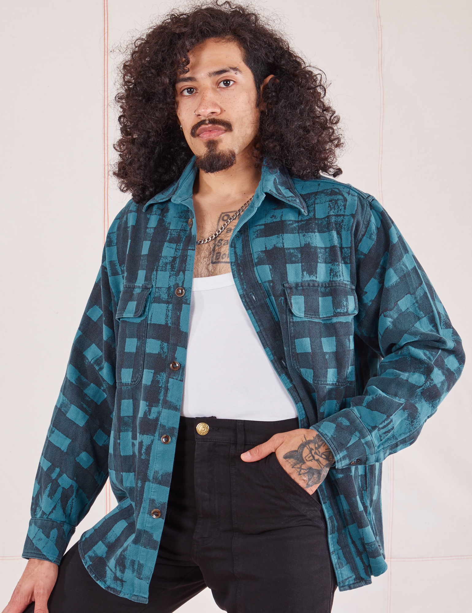 Jesse is 5&#39;8&quot; and wearing XS Plaid Flannel Overshirt in Marine Blue