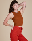 Racerback Tank in Burnt Terracotta angled front view on Alex