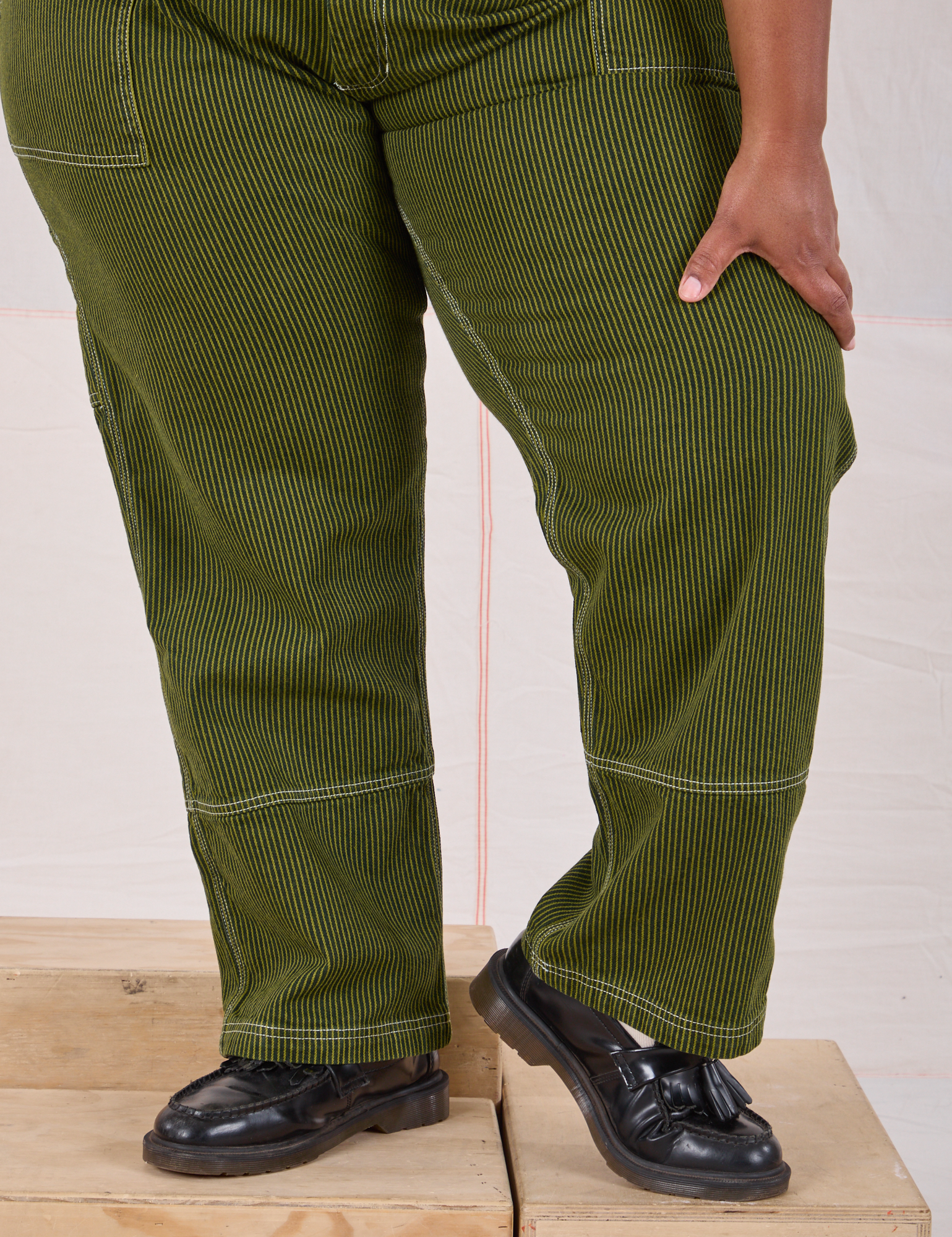Railroad Carpenter Jeans in Summer Olive pant leg close up on Morgan