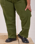 Railroad Carpenter Jeans in Summer Olive pant leg close up on Morgan