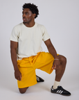 Longline Work Shorts in Sunshine Yellow and Burly Tee in Vintage Tee White on Isaac