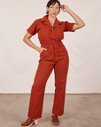 Tiara is 5'4" and wearing S Short Sleeve Jumpsuit in Paprika