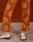 Paintstamped Work Pants in Orange pant leg close up on Madeline