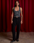 Cropped Tank Top in Spider Webs and black Work Pants on Anthony