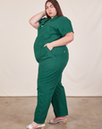 Side view of Short Sleeve Jumpsuit in Hunter Green worn by Marielena