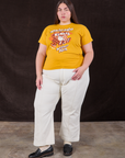 Marielena is wearing Wicker Park Tourist Tee and vintage tee off-white Western Pants