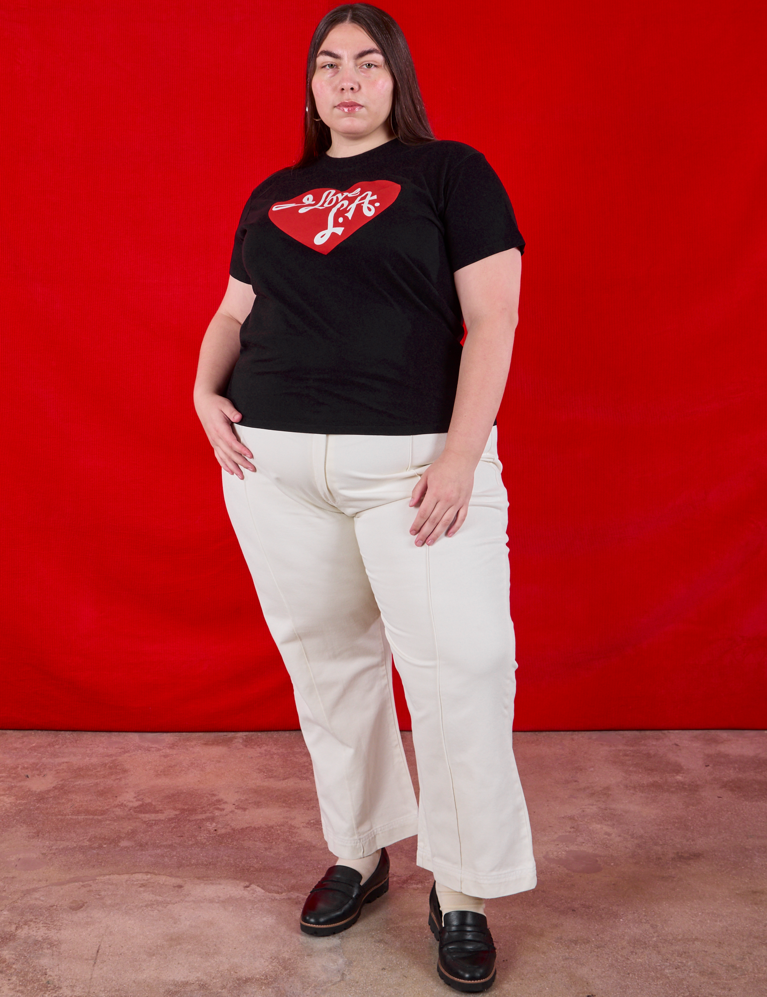 Marielena is wearing I love LA Tourist Tee  and vintage tee off-white Western Pants