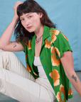 Alex is wearing Paintstamped Pantry Button-Up in Kelly Green